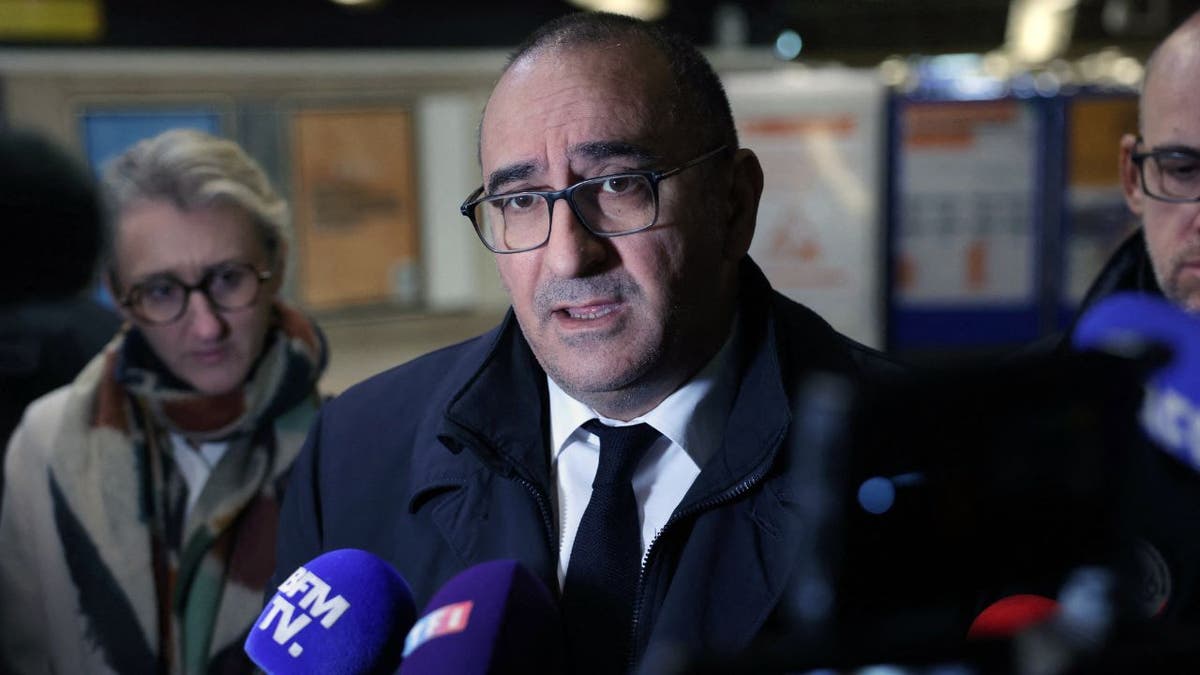 Paris' police prefect Laurent Nunez (C) talks to the press