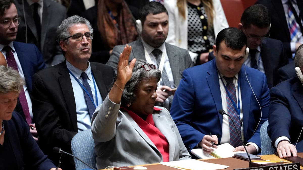 USUN Ambassador Linda Thomas Greenfield votes in a Security Council meeting on Gaza.