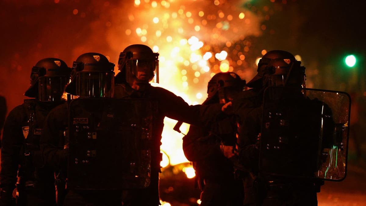 French police near fire