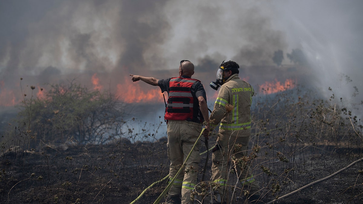 Firefighters work to extinguish a fire 