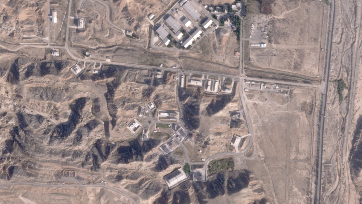 This satellite photo from Planet Labs PBC shows damaged buildings at Iran's Parchin military base outside of Tehran, Iran, Sunday, Oct. 27, 2024. An Israeli attack on Iran damaged facilities at a secretive military base southeast of the Iranian capital that experts in the past have linked to Tehran's onetime nuclear weapons program and at another base tied to its ballistic missile program, satellite photos analyzed Sunday by The Associated Press show. The damaged structures are in the bottom right corner and bottom center of the image. 