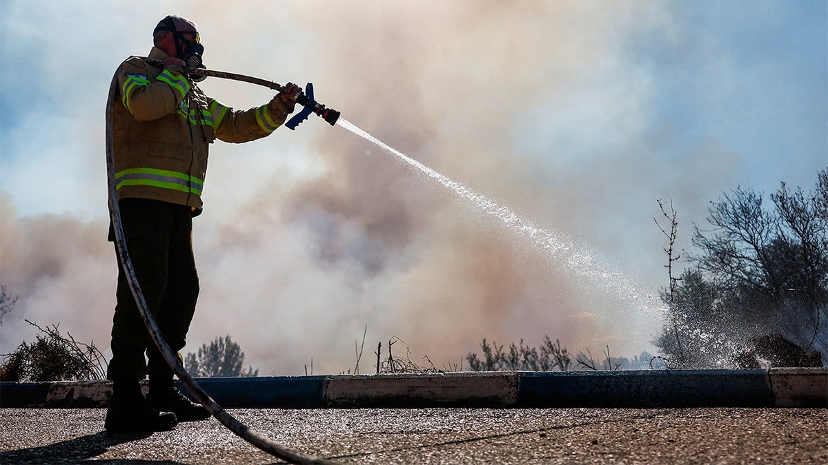 Fire rescue personnel respond to the scene of a rocket attack