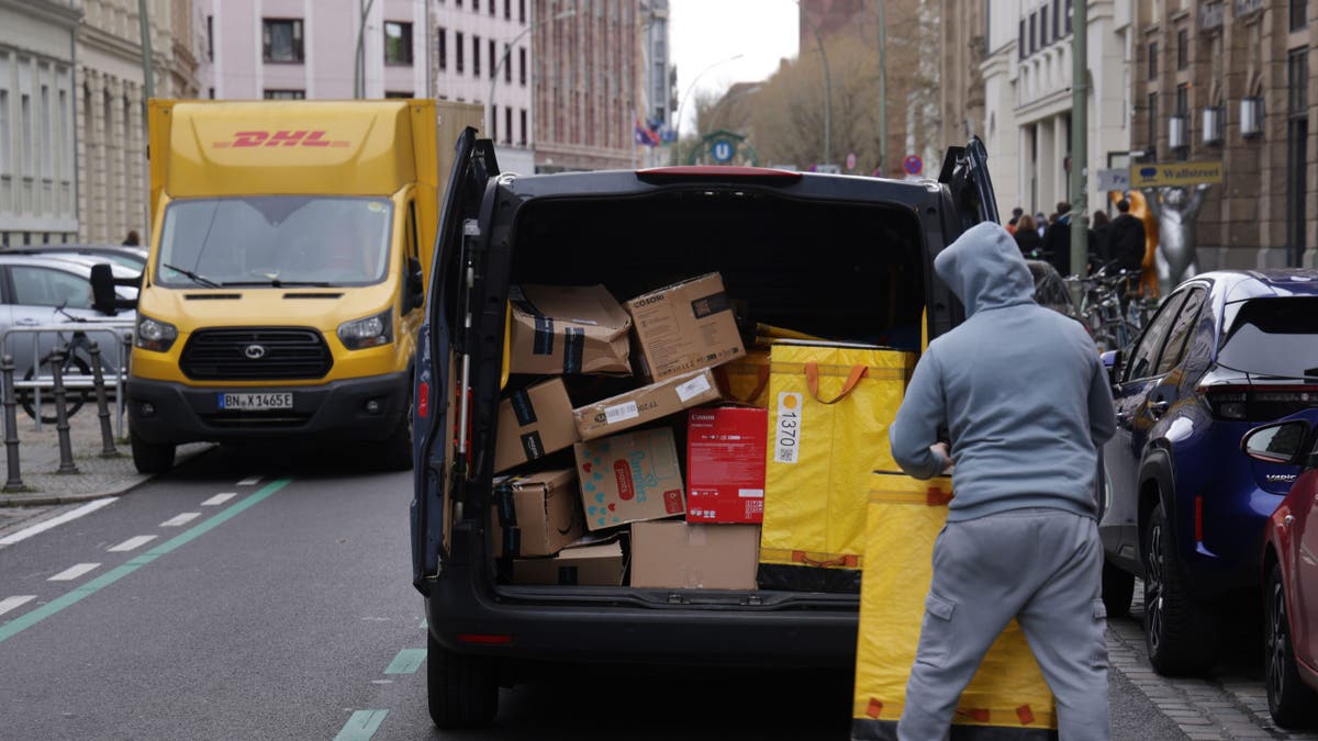 DHL boxes loaded into van