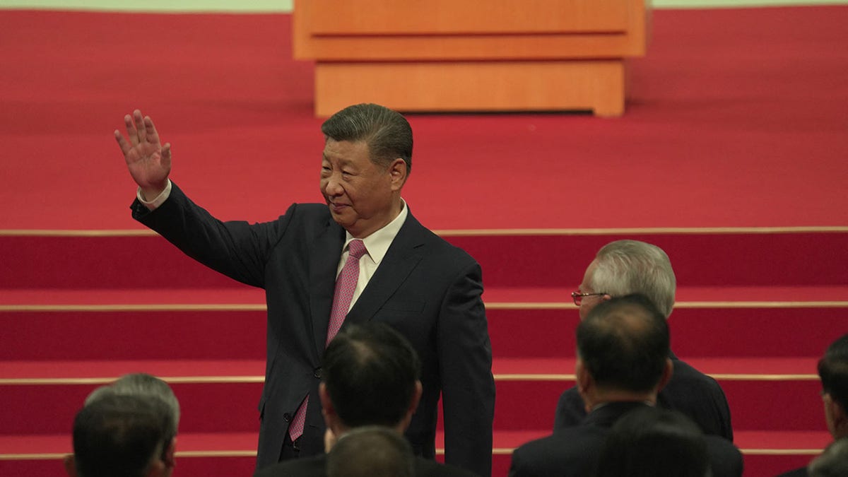 Xi Jinping waves at event