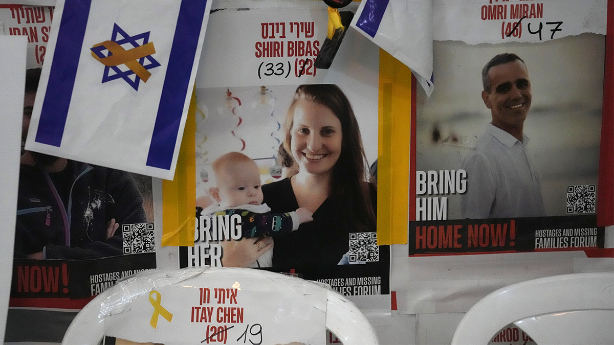 A poster shows Shiri Bibas, who was kidnapped to Gaza with her husband and two young sons