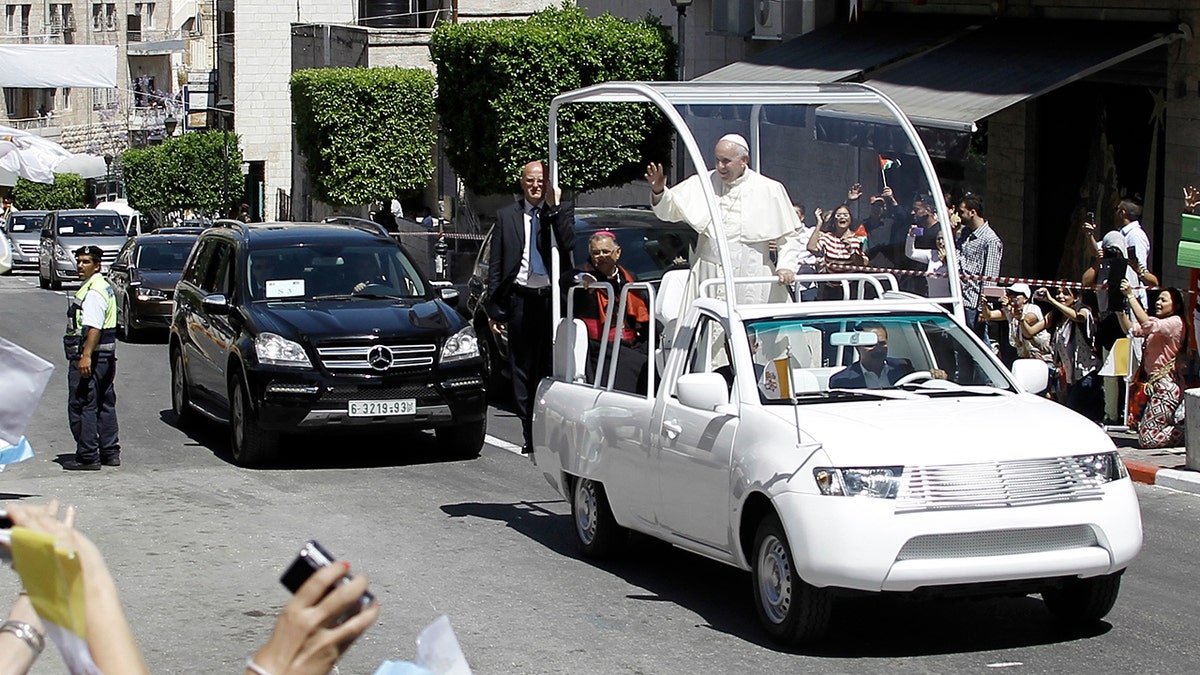 Pope Francis in popemobile driving in Bethlehem