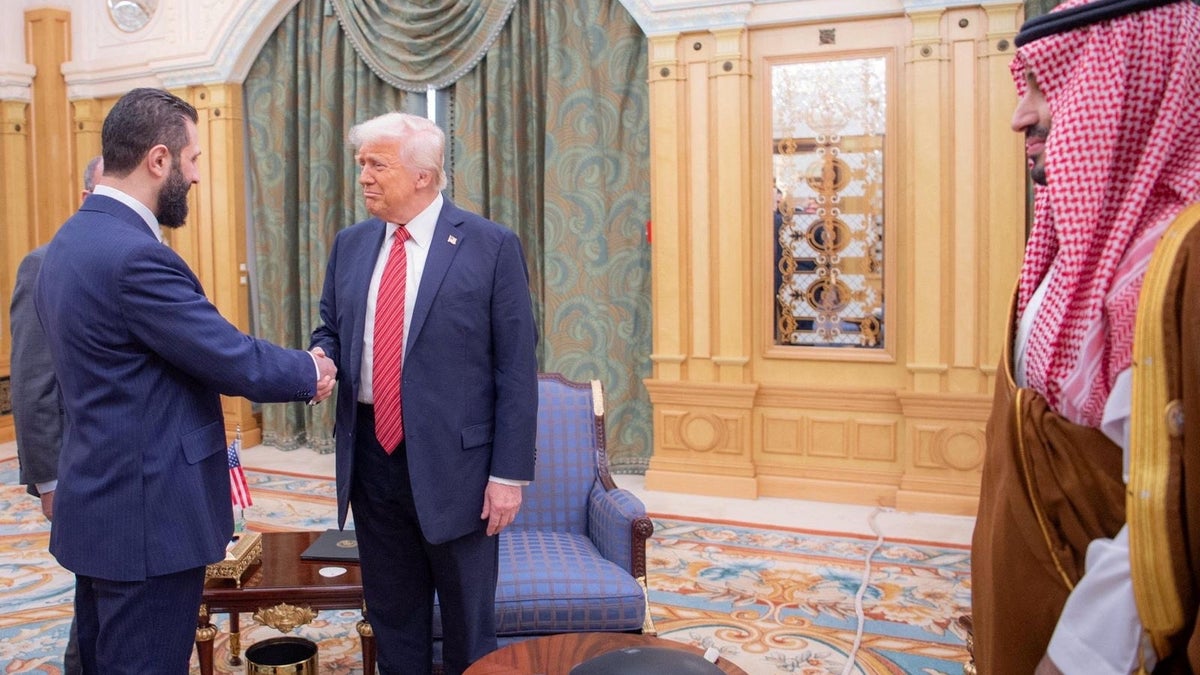 U.S. President Donald Trump meets with Syrian President Ahmed al-Sharaa in Riyadh, Saudi Arabia, in this handout released on May 14, 2025. Saudi Press Agency/Handout via Reuters.