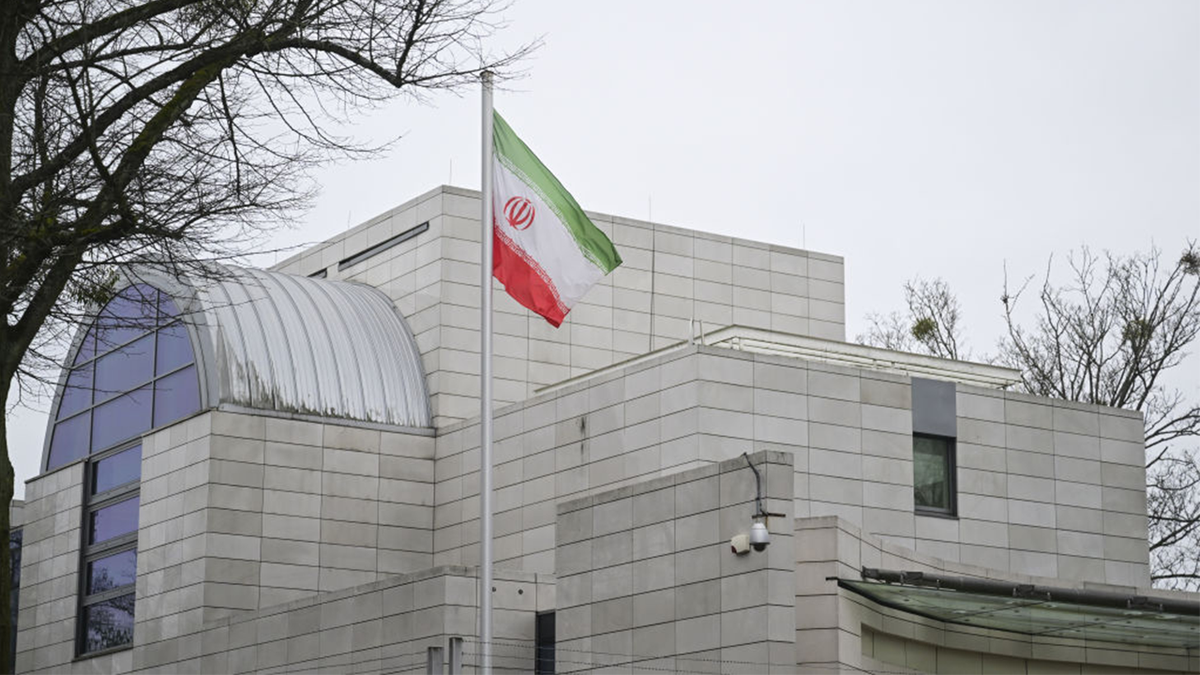 The Iranian flag flies in front of the Iranian Embassy in Berlin.
