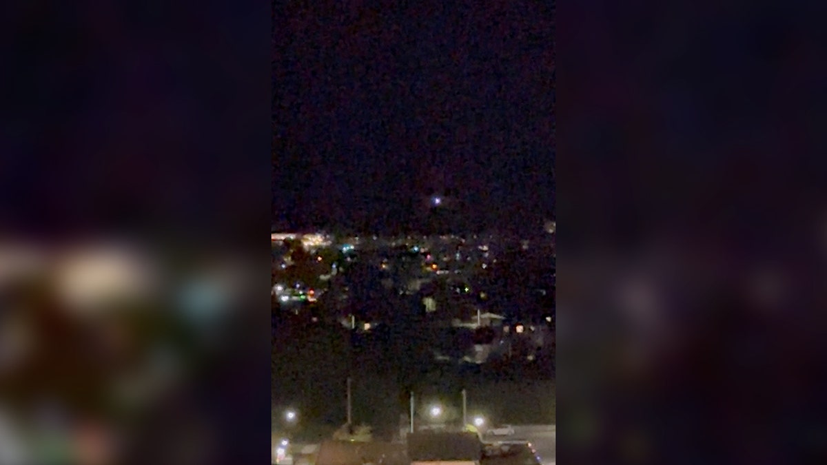 A light moves in the sky over Aalborg, Denmark, on Sept. 24, 2025, amid reports of drone sightings that led to the city's airport being closed. 