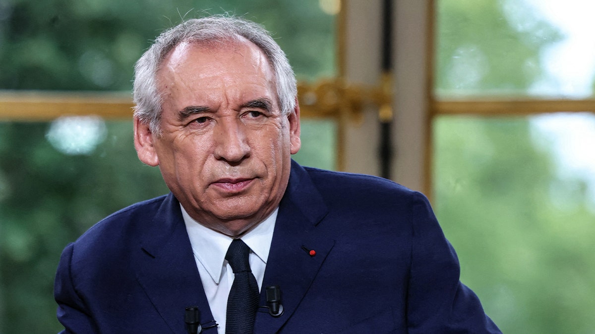 France's Prime Minister Francois Bayrou in blue suit