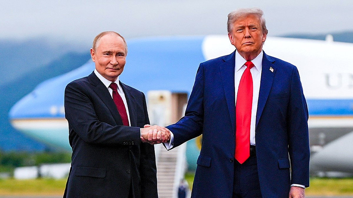 Putin and Trump shake hands