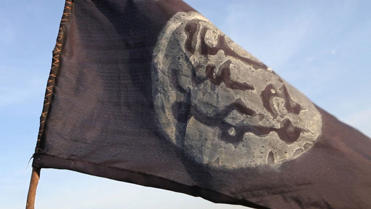 A Boko Haram flag flutters from an abandoned command post in Gamboru deserted after Chadian troops chased jihadists from the border town on February 4, 2015. 