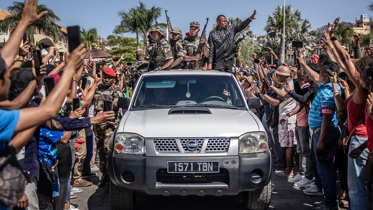 Members of Madagascar CAPSAT army unit surrounded by crowd