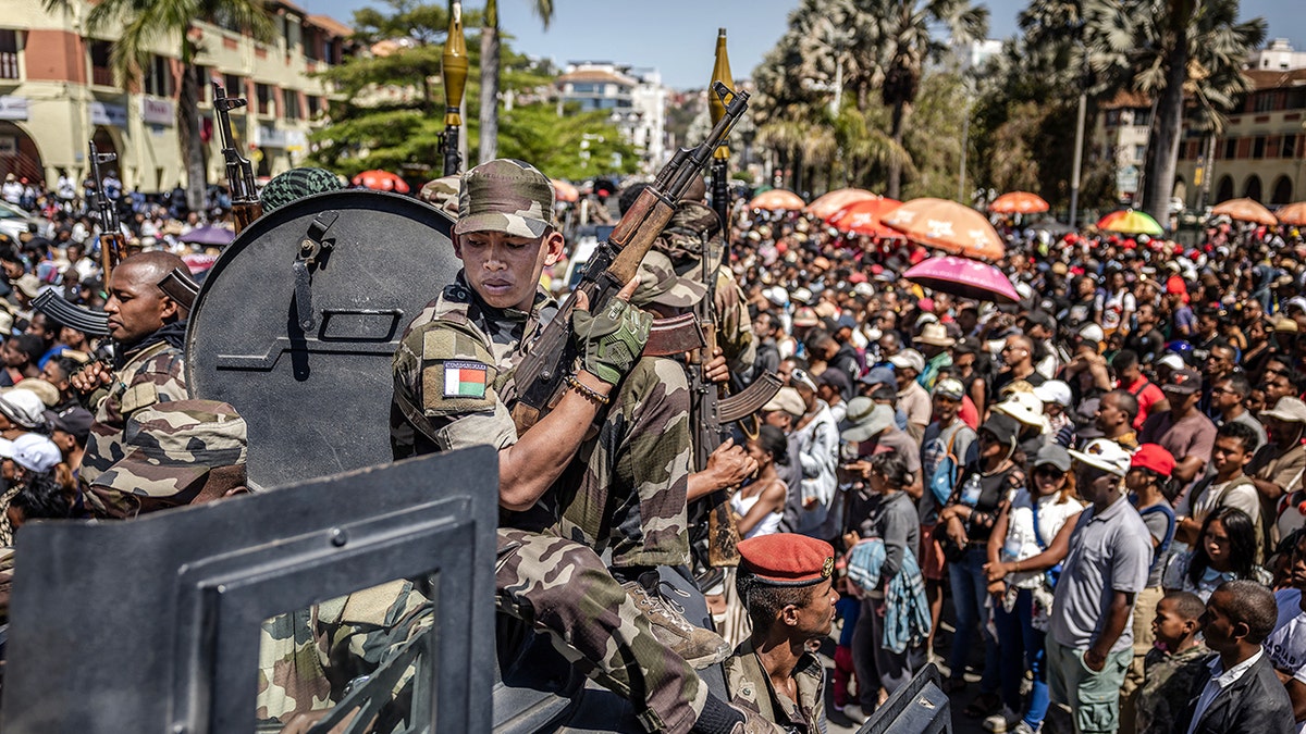Members of Madagascar's CAPSAT army unit surrounded by crowd