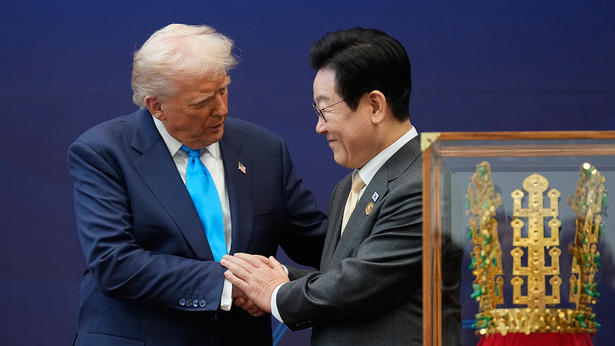 President Donald Trump shakes hands with South Korean President Lee Jae Myung