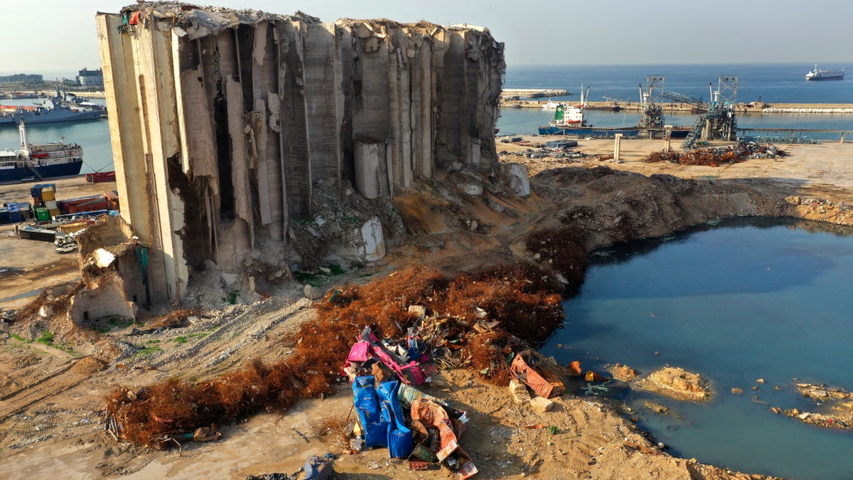 Rubble and debris remain around towering grain silos gutted in the massive August explosion at the Beirut port that claimed the lives of more than 200 people, in Beirut, Lebanon, Wednesday, Dec. 2, 2020. One of the most anticipated moments will come on Dec. 2, when Leo visits the Port of Beirut. Hussein Malla/AP