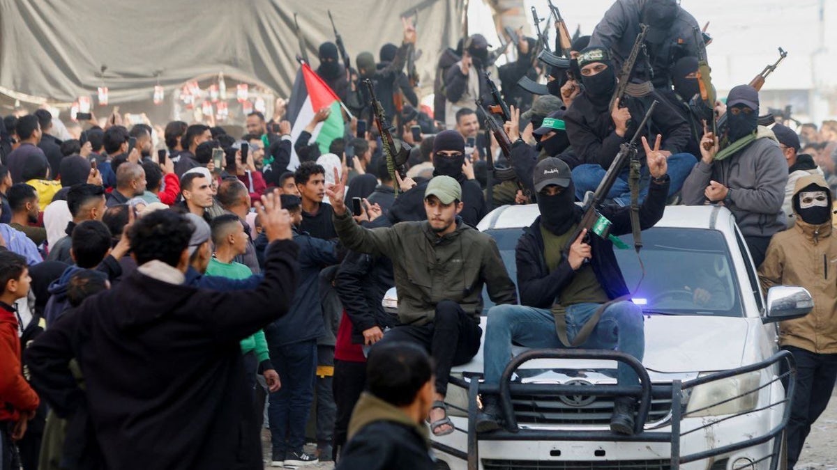 Suspected terrorists in Gaza come out of hiding as cease-fire for hostages deal gets underway in Gaza's Deir al-Balah area.