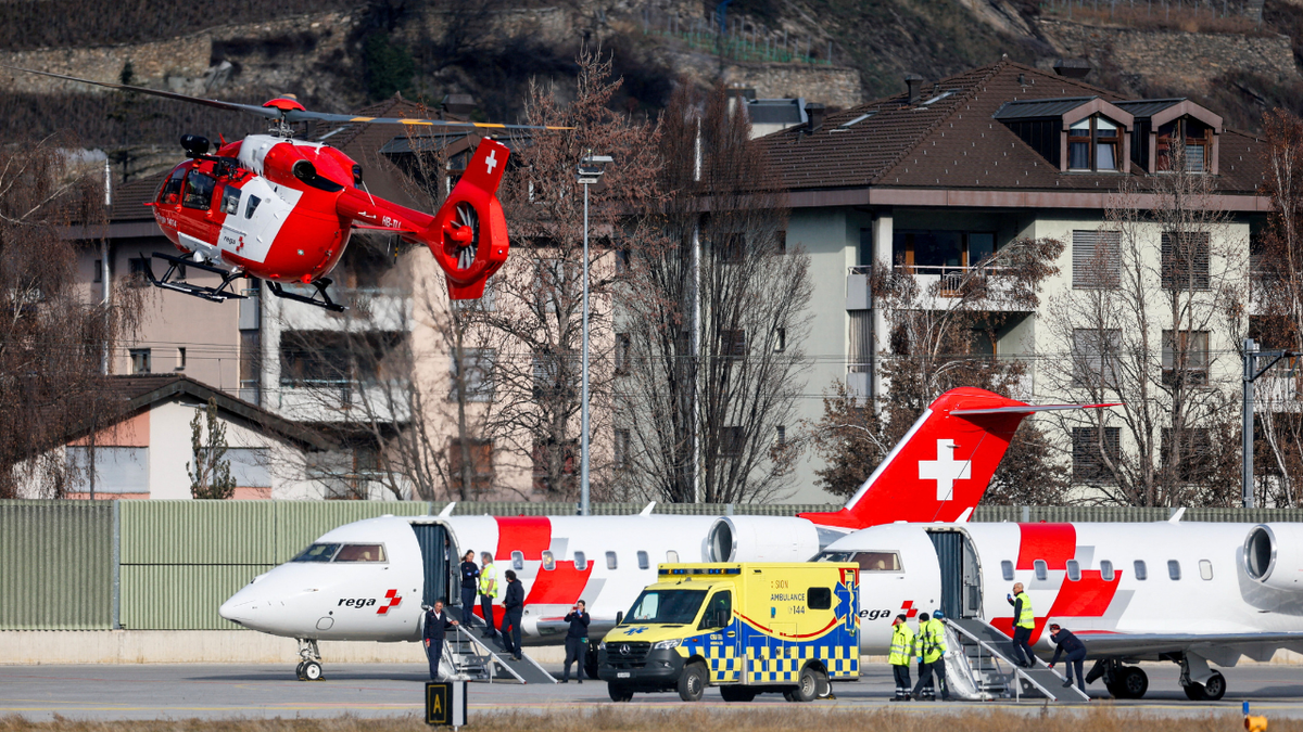 Emergency crews and medical aircraft are seen at a regional airport in Switzerland as victims of a deadly New Year’s Eve bar fire in the Alpine resort town of Crans-Montana were transported for treatment.