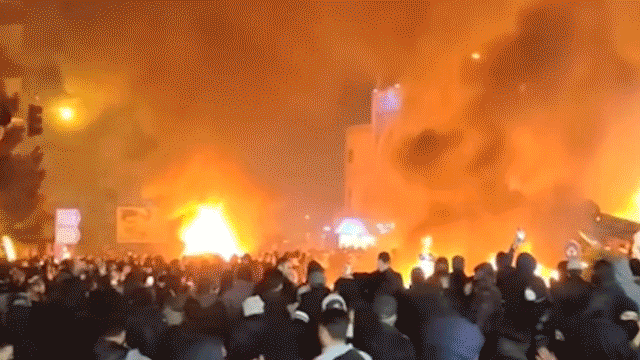 Protesters set cars on fire in Iran