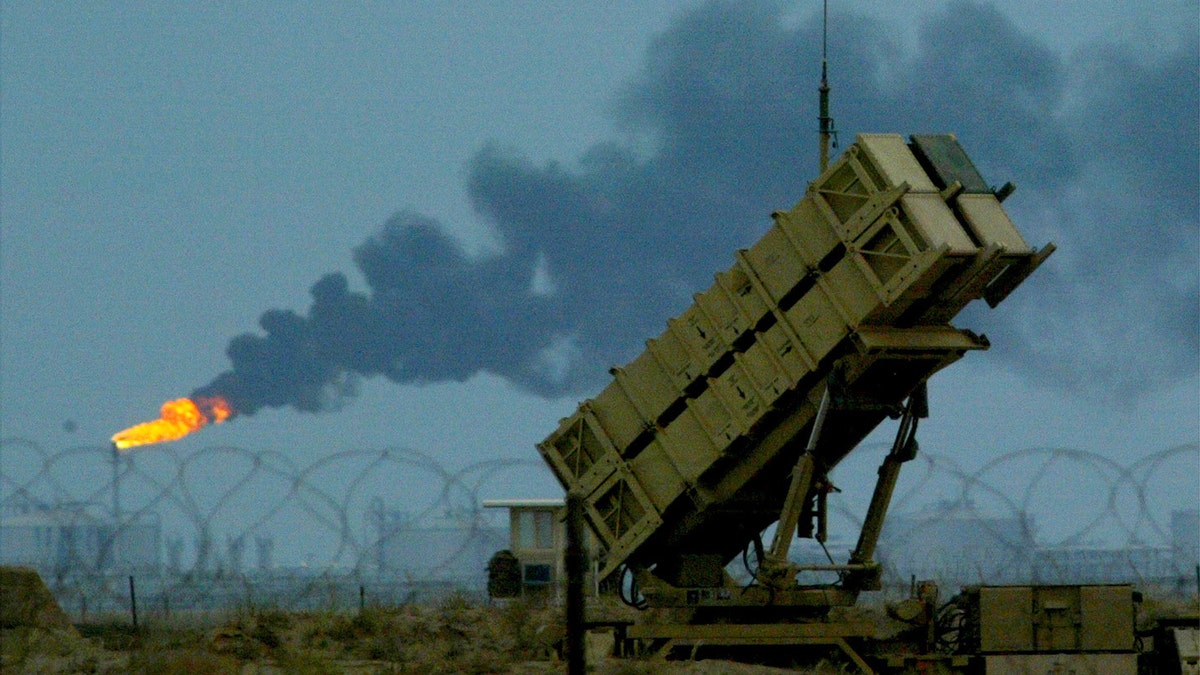 U.S manned Patriot missiles protect a nearby British and U.S airbaseinfront of the oilfields in Kuwait March 16, 2003. Aircraft from theU.S. and Britain are continuing to enforce the no-fly zone oversouthern Iraq. REUTERS/Russell BoyceRUS/CRB - RTRK4I5