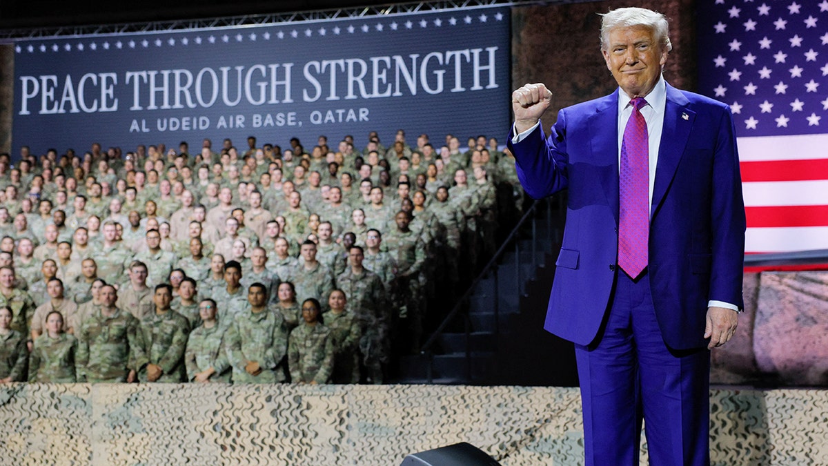 Trump raises his fist while visiting U.S. troops in Qatar
