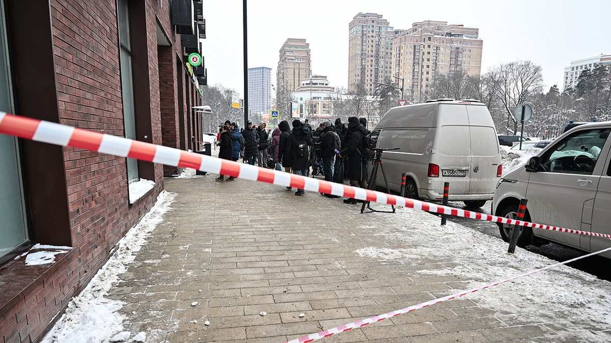 Media figures gather in front of building in Moscow