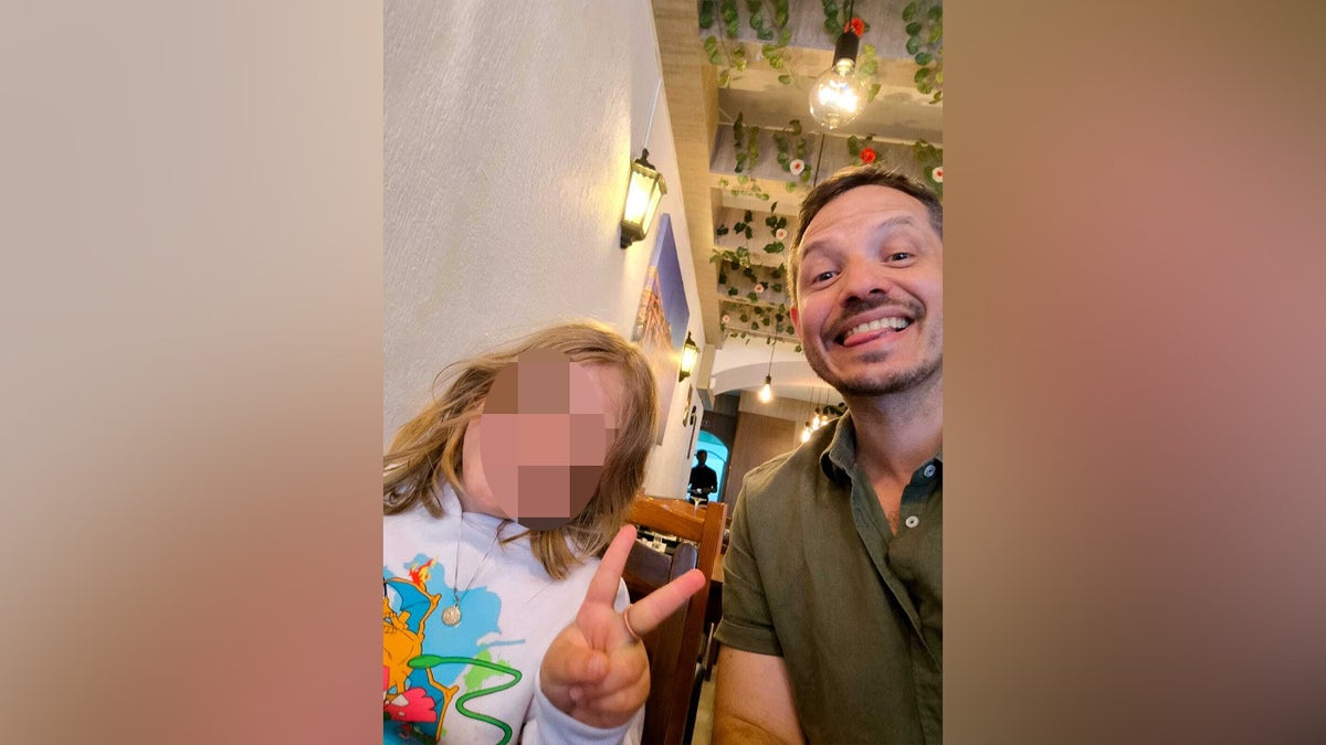 Alexandre Rocha with his son