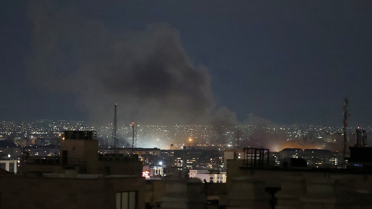 Strike in tehran smoke rises