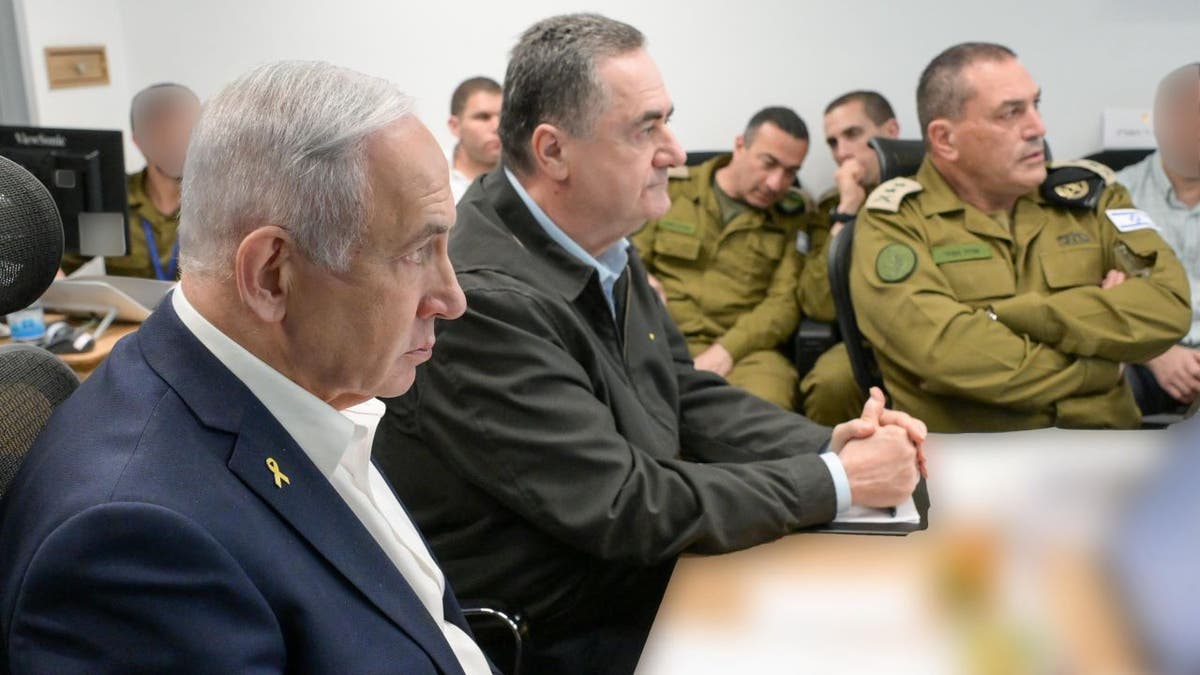 Israeli Prime Minister Benjamin Netanyahu standing with Defense Minister Israel Katz