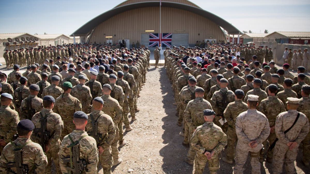 British troops and ISAF personnel gather at Kandahar Airfield for Remembrance Sunday service