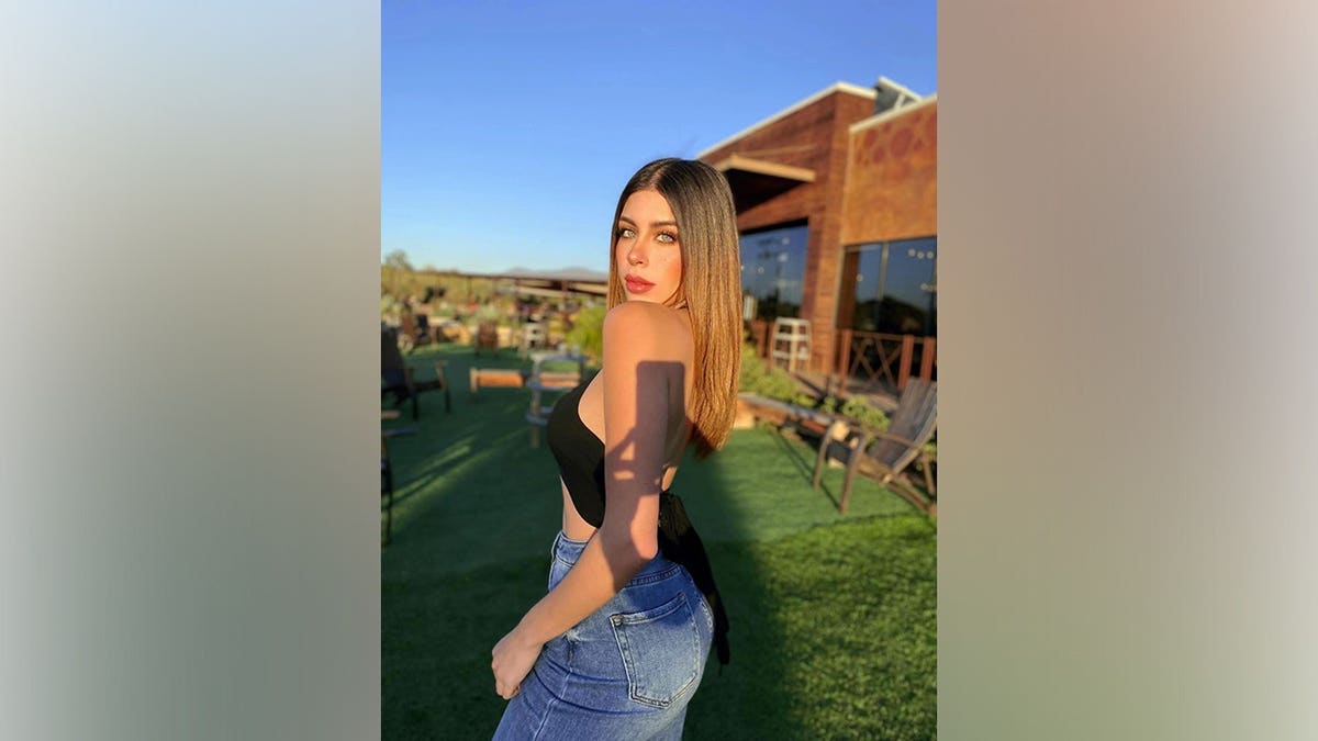 Former beauty queen Carolina Flores Gómez standing and smiling