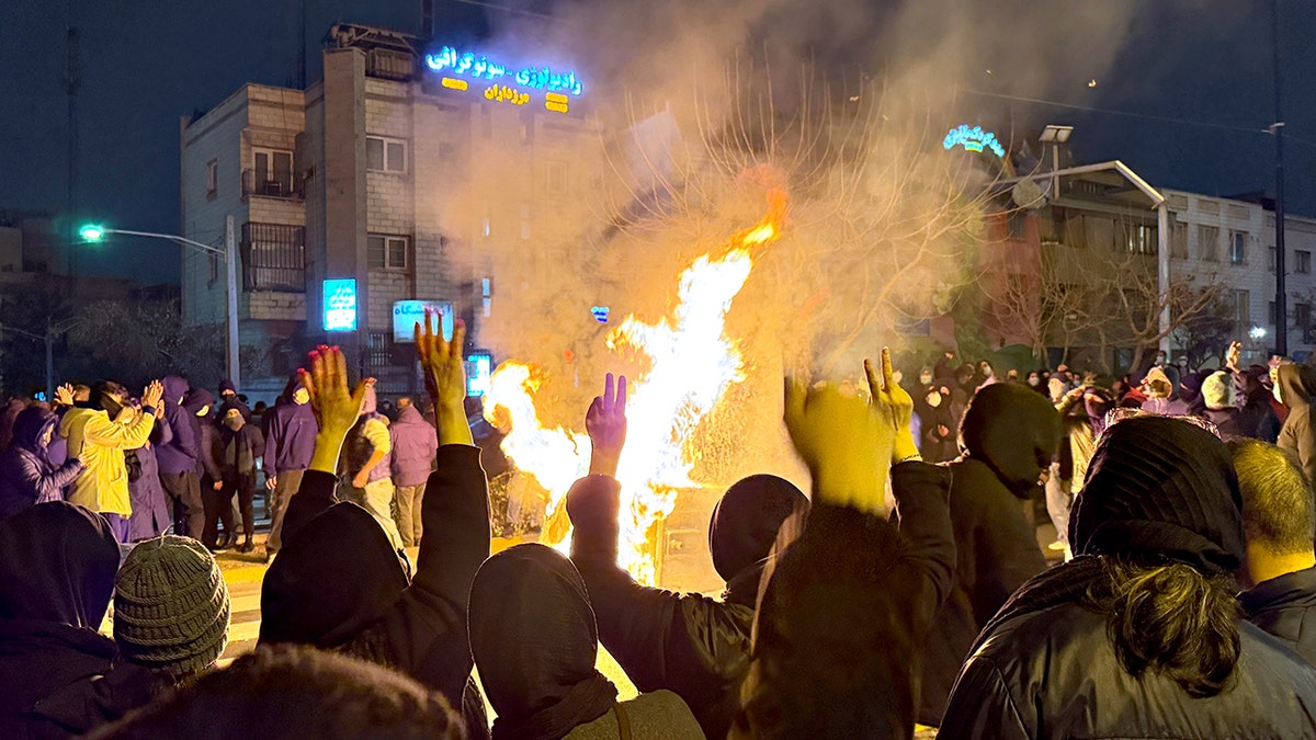 Iranians attending an anti-government protest in Tehran