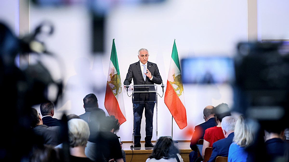 Reza Pahlavi speaking at a press conference in Paris