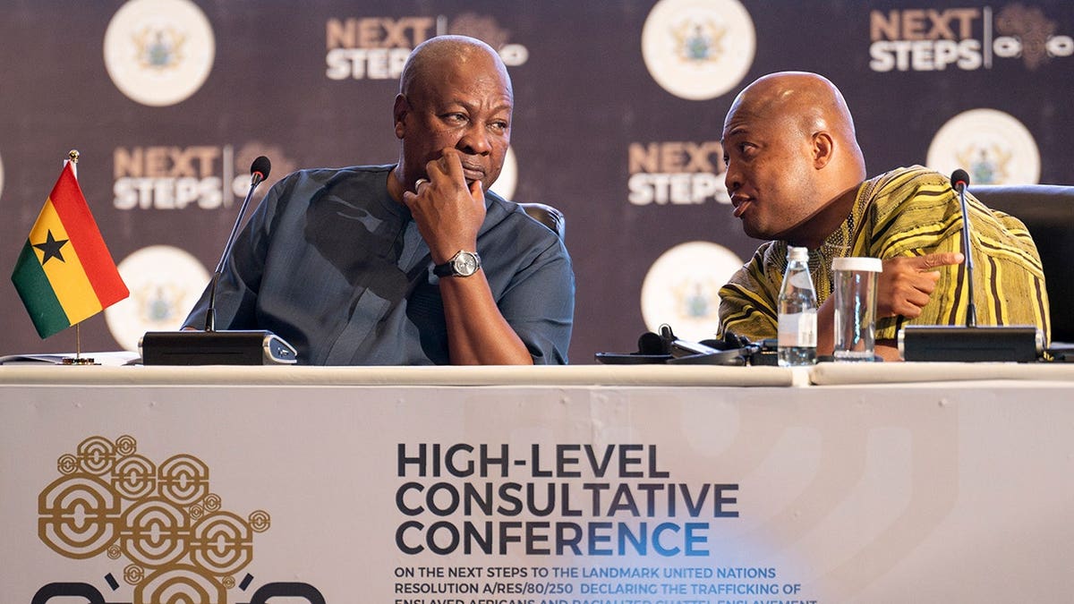 John Dramani Mahama and Samuel Okudzeto Ablakwa seated at a conference table in Accra, Ghana.