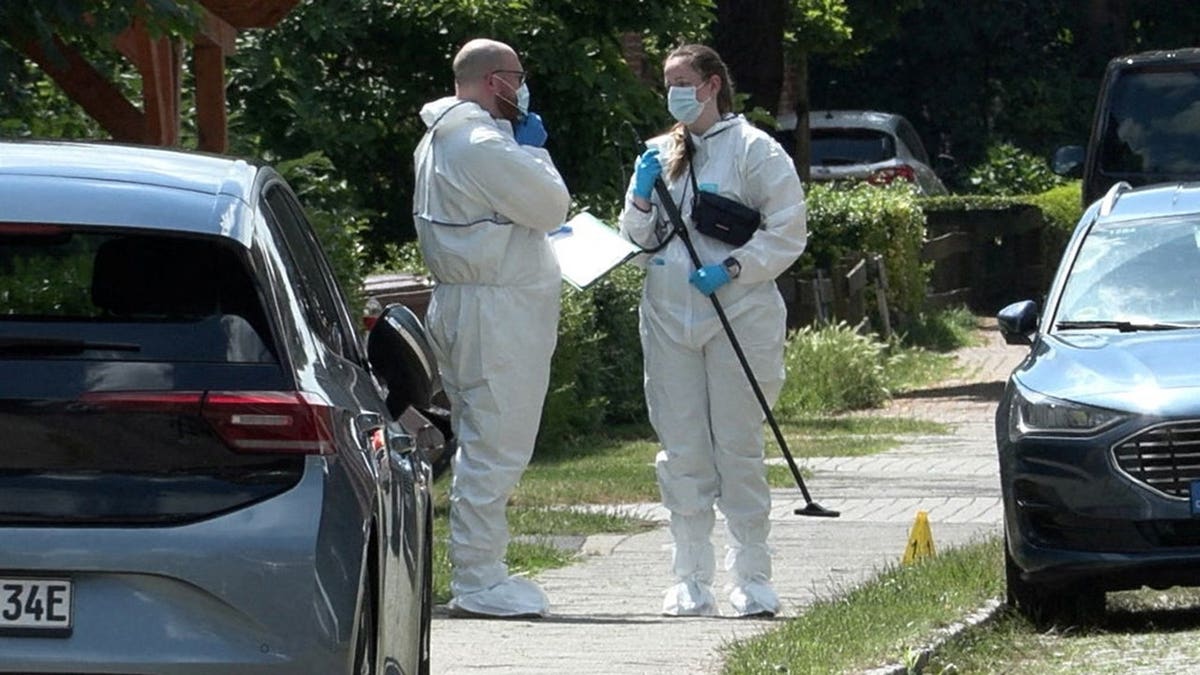 Members of emergency services working at the scene of a shooting in Stade, Germany
