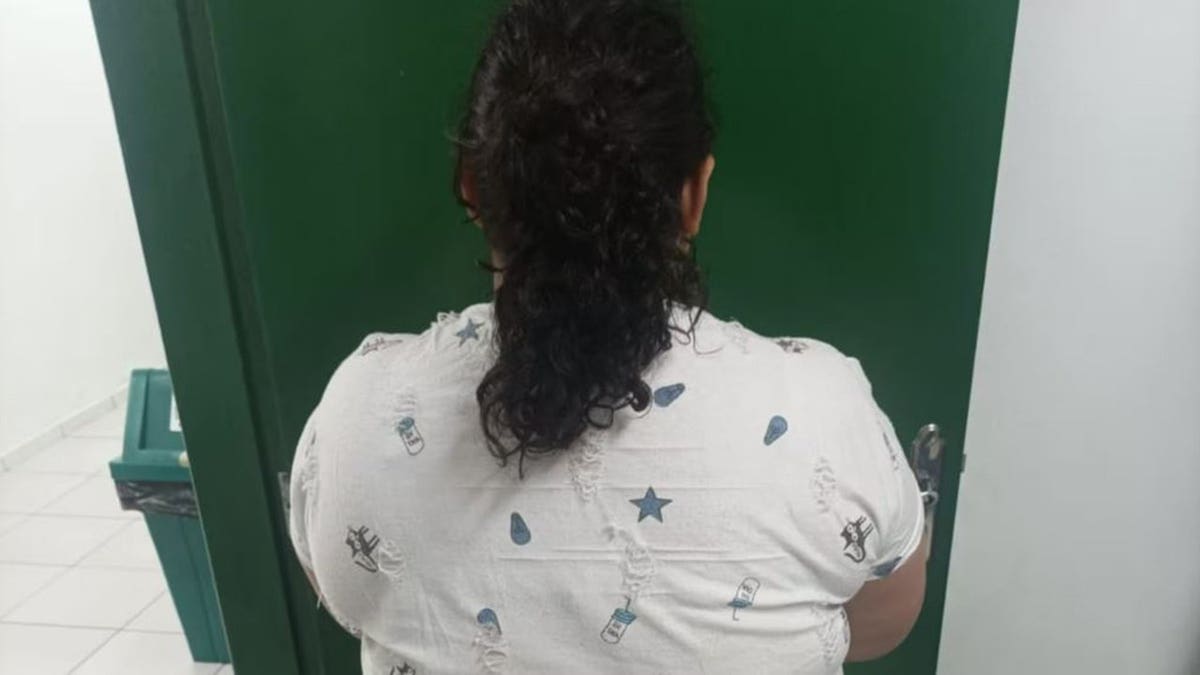Oliveria from back at police station
