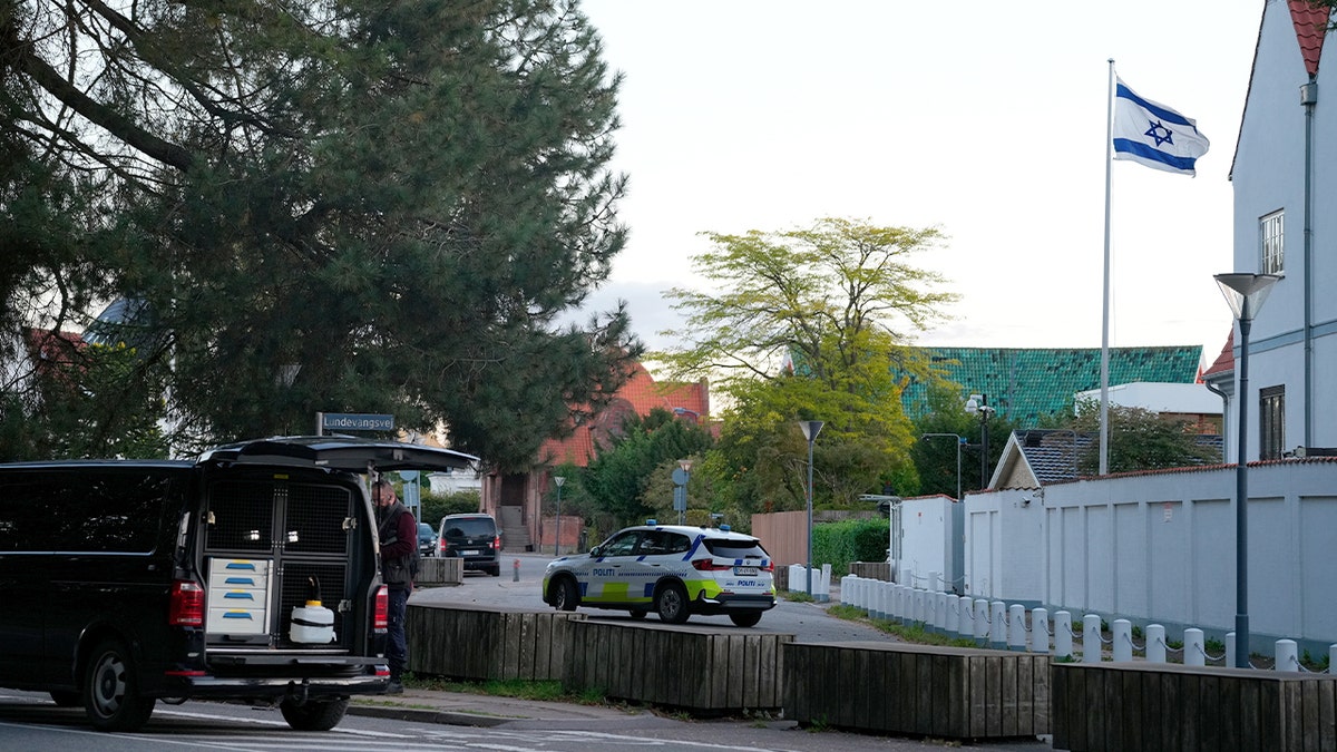 A police vehicle parked near the Israeli Embassy in Denmark