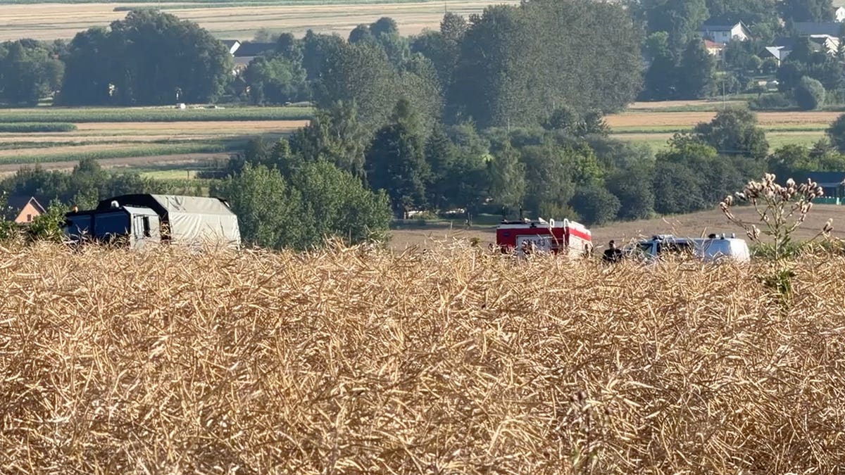 Polish army secures a large crater in Tarnawa-Kolonia, eastern Poland.