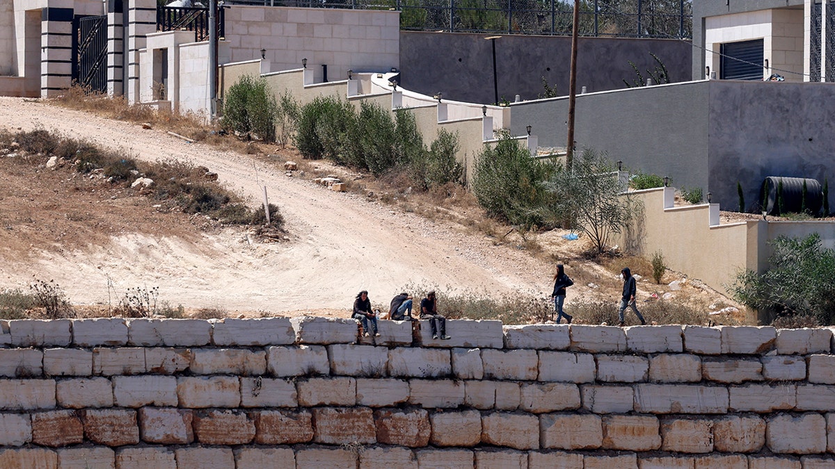 Settlers in Qusra