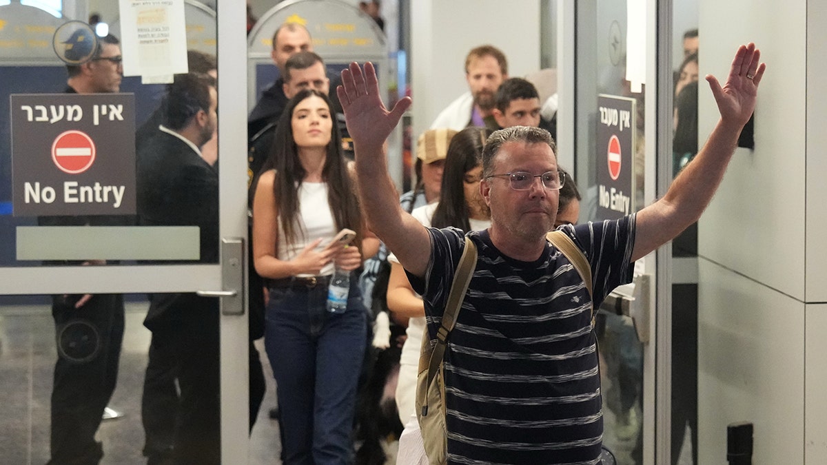 Israeli passenger Haim Lazarovich, who experienced an emergency landing in Saudi Arabia, during a flight on FlyDubai plane, arrives at Ben Gurion International Airport, near Tel Aviv, Israel, Wednesday, Sept. 30, 2026. (AP Photo/Ariel Schalit)