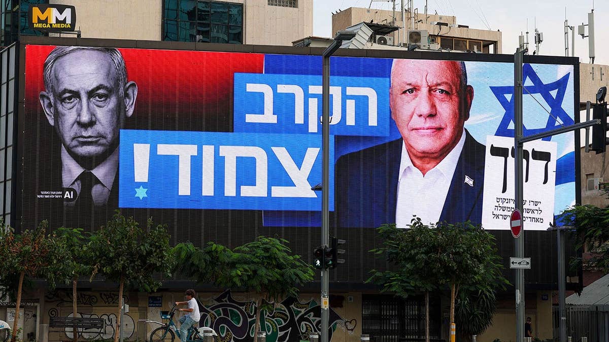 Posters of former Israeli Chief of General Staff and Yashar Party leader Gadi Eisenkot (right) and Prime Minister and Likud Party leader Benjamin Netanyahu (left)