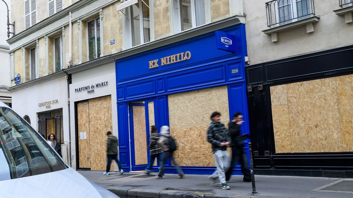Boarded up stores, including Christian Dior, Parfums de Marly and Ex Nihilo, on Rue Saint-Honore following looting in central Paris, France, on Wednesday, Oct. 21, 2026. Luxury boutiques in Paris's shopping districts have been damaged after a weekend of rioting, with some boarding up windows and doors and increasing security measures.