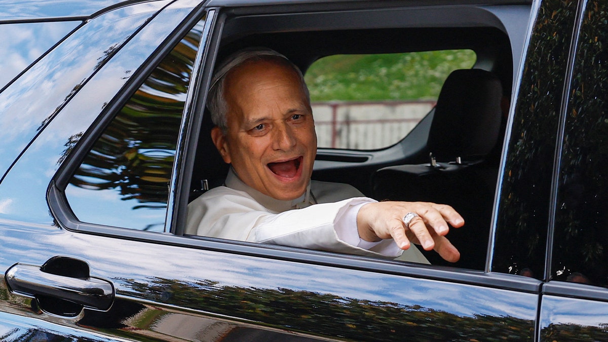Pope Leo reacts while sitting in a car as he leaves Gemelli Hospital following his lung surgery and cancer diagnosis, in Rome, Italy, October 17, 2026.